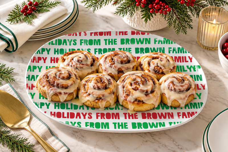 Christmas morning cinnamon rolls on a personalized Happy Holidays platter