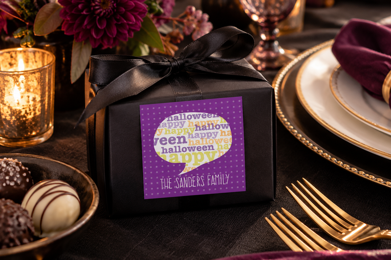 Black Halloween favor box sealed with a personalized Happy Halloween label