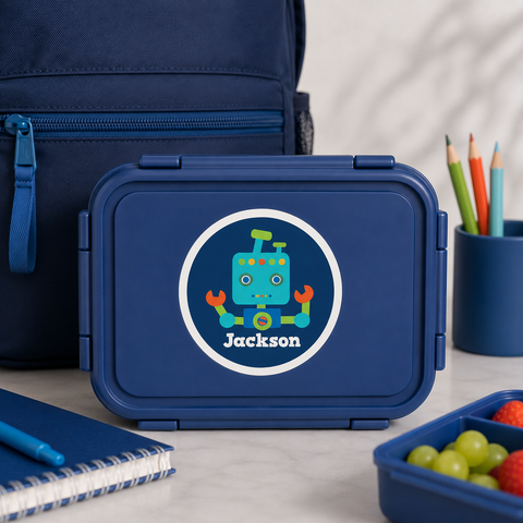 Colorful illustrated robot name label on a navy blue kids bento lunchbox for back to school - Label Circus