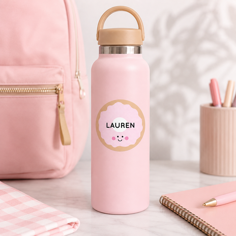 Personalized kawaii donut name label on a pink stainless steel kids water bottle for school - Label Circus